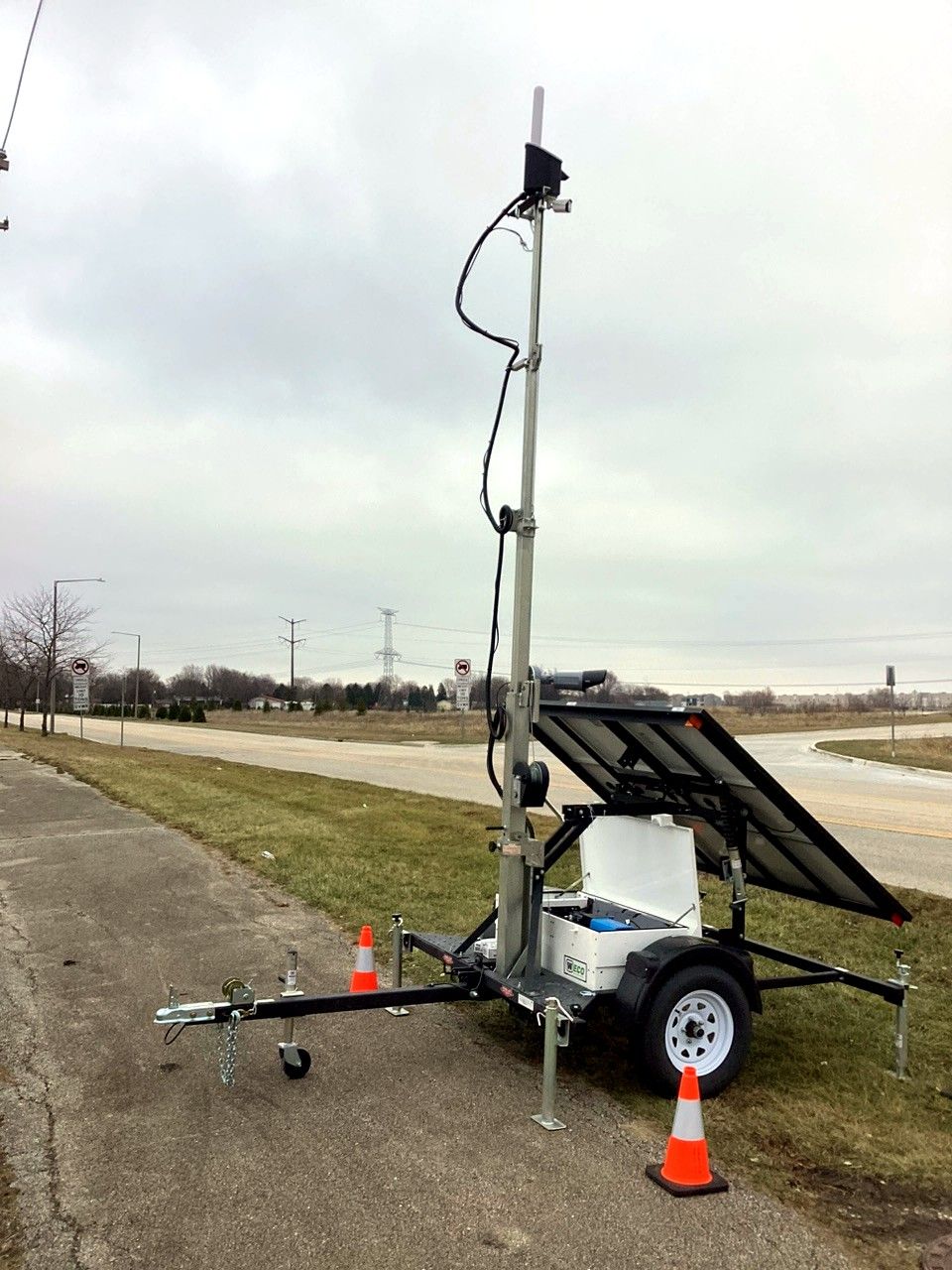Portable LiDAR trailer with solar array deployed on a roadway shoulder